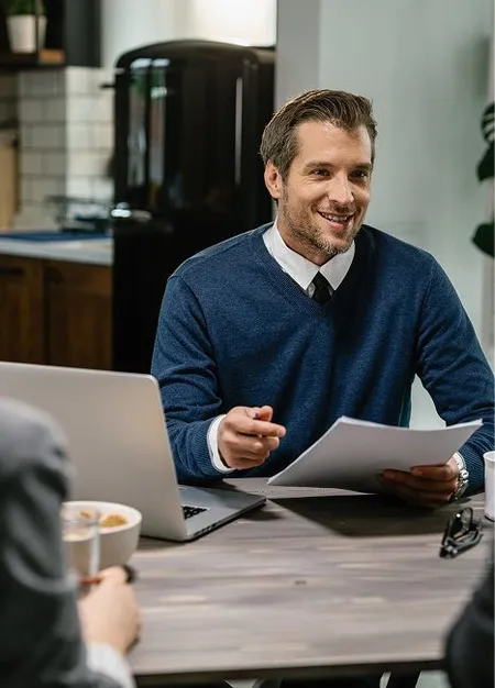 smiling-financial-consultant-communicating-with-couple-meeting-their-home.jpg